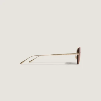 Lunettes de soleil ovales avec monture en métal doré